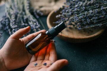 Natural cosmetic product with lavender in hands
