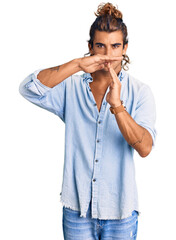 Young hispanic man wearing summer style doing time out gesture with hands, frustrated and serious...