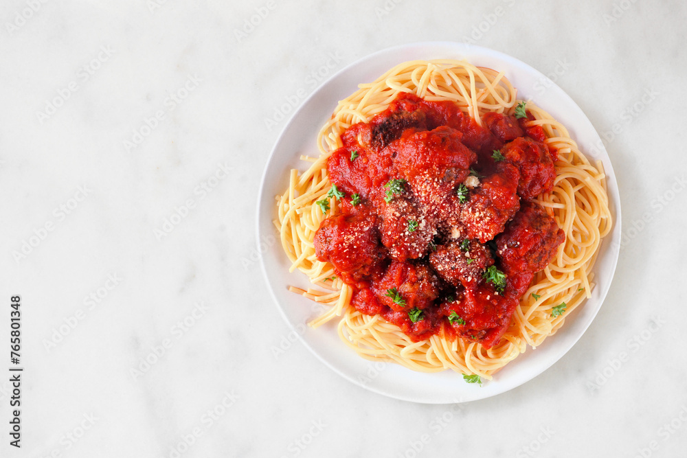 Wall mural Homemade spaghetti and meatballs with tomato sauce. Top view on a white marble background. - Wall murals