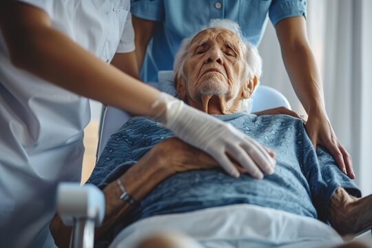 Elderly man receiving care from health professionals.