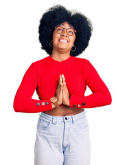 Young african american girl wearing casual clothes and glasses begging and praying with hands...