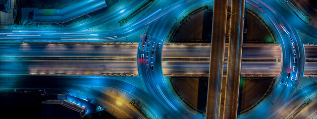 Expressway top view, Road traffic an important infrastructure, Drone aerial view fly in circle, traffic transportation, Public transport or commuter city life concept of economic and energ, transport. - obrazy, fototapety, plakaty