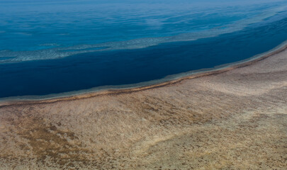 Aerial view of Great Barrier Reef coral reef structure in Whitsundays, Aerilie beach, Queensland,...