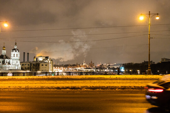 view of Kremlin from Bolshoy Ustinsky Bridge in Moscow city in winter evening
