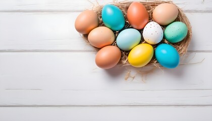 Colorful Easter eggs on a white wooden background