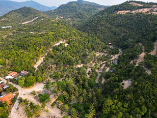 Aerial drone view small Koh Ma island, Ko Phangan Thailand. Exotic coast panoramic landscape, Mae Haad beach, summer day. Sandy path between corals. Vivid seascape, mountain coconut palms from above.
