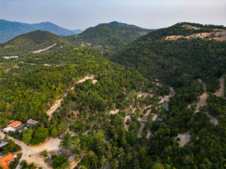 Aerial drone view small Koh Ma island, Ko Phangan Thailand. Exotic coast panoramic landscape, Mae Haad beach, summer day. Sandy path between corals. Vivid seascape, mountain coconut palms from above.
