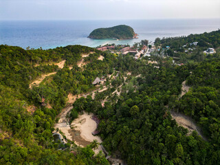 Aerial drone view small Koh Ma island, Ko Phangan Thailand. Exotic coast panoramic landscape, Mae Haad beach, summer day. Sandy path between corals. Vivid seascape, mountain coconut palms from above.