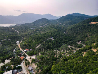 Aerial drone view small Koh Ma island, Ko Phangan Thailand. Exotic coast panoramic landscape, Mae Haad beach, summer day. Sandy path between corals. Vivid seascape, mountain coconut palms from above.