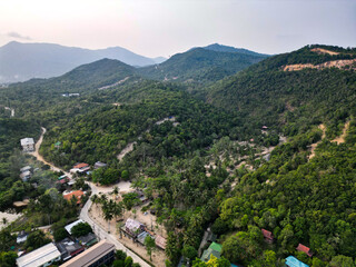 Aerial drone view small Koh Ma island, Ko Phangan Thailand. Exotic coast panoramic landscape, Mae Haad beach, summer day. Sandy path between corals. Vivid seascape, mountain coconut palms from above.