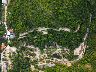 Aerial drone view small Koh Ma island, Ko Phangan Thailand. Exotic coast panoramic landscape, Mae Haad beach, summer day. Sandy path between corals. Vivid seascape, mountain coconut palms from above.