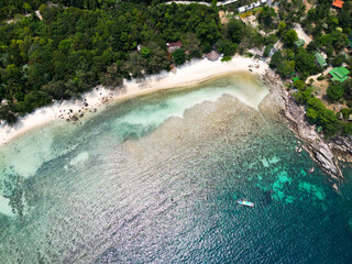 Aerial drone view small Koh Ma island, Ko Phangan Thailand. Exotic coast panoramic landscape, Mae Haad beach, summer day. Sandy path between corals. Vivid seascape, mountain coconut palms from above.