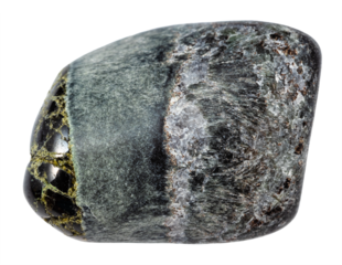 close up of sample of natural stone from geological collection - tumbled richterite and diopside mineral isolated on white background from Kola Peninsula