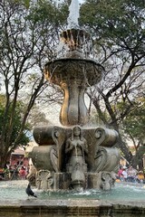 A beautiful water fountain in the Central Park in Antigua, Guatemala