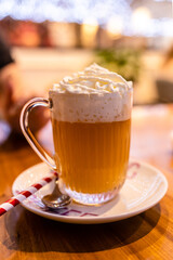 butter beer cocktail with whipped cream close up in local bar
