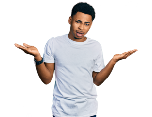 Young african american man wearing casual white t shirt clueless and confused with open arms, no idea concept.