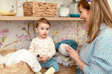 Mom showing her daughter stuffed shark toy. Mothers day
