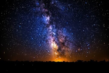 Obraz premium The Milky Way's detailed core brightly shining over the horizon at night.