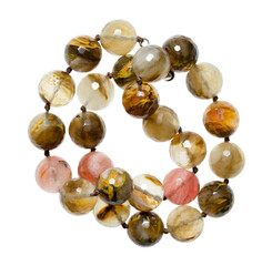 tangled vintage necklace from various natural quartz round beads isolated on white background
