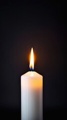 One red candle burns on a dark background. Memory, memorial, romance, prayer, religion. Copyspace, free space, place for text. Vertical banner