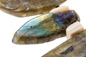 polished bead of natural labradorite gemstone isolated on white background close up