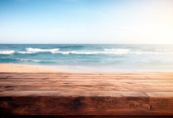 Wooden table with copy space, blurred ocean background, sunny beach summer backdrop - 765862752