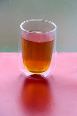 hot tea in transparent glass mug
