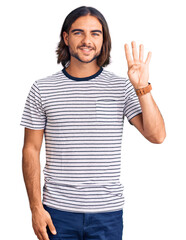 Young handsome man wearing casual clothes showing and pointing up with fingers number four while...