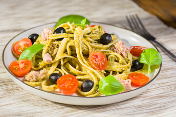 pasta with pesto and tuna - 765866921
