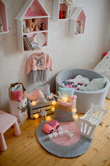 Kids room with toys, pillows and furniture