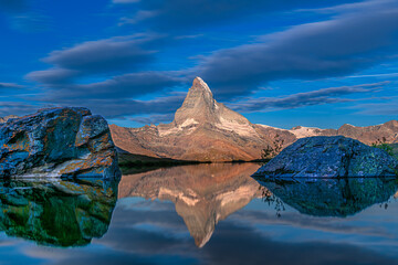 The Matterhorn reflected in Stellisee lake in the Swiss Alps