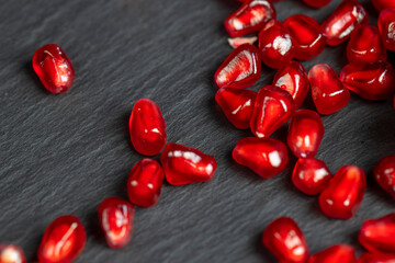 red grains of peeled pomegranate fruit