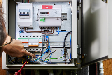 Wiring installation in rural house, connect three-phase power cable for external distribution board.