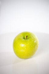 beautiful fresh and radiant green apple, healthy and natural food on white background