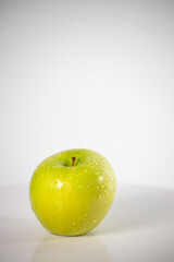 beautiful fresh and radiant green apple, healthy and natural food on white background