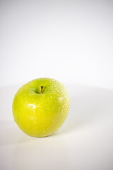 beautiful fresh and radiant green apple, healthy and natural food on white background