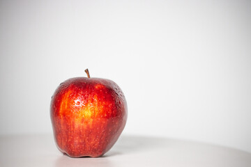 beautiful fresh and radiant red apple, healthy and natural food on white background