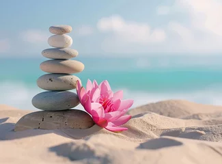 Fototapete Balanced stack of smooth stones with a pink lotus flower on sand © Nld