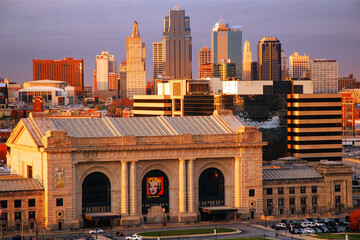 Union Station, a historic train station in Kansas City, Missouri stands in front of the city skyline at night