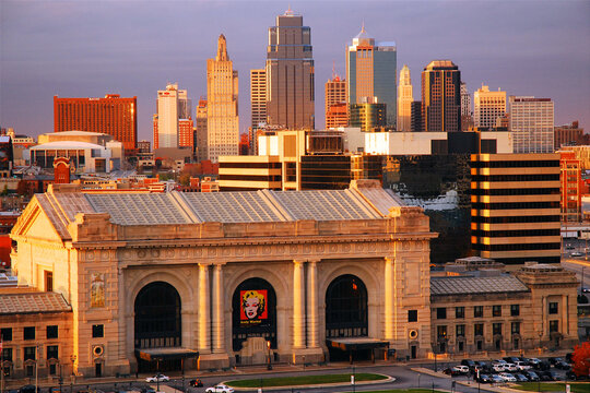 Union Station, a historic train station in Kansas City, Missouri stands in front of the city skyline at night