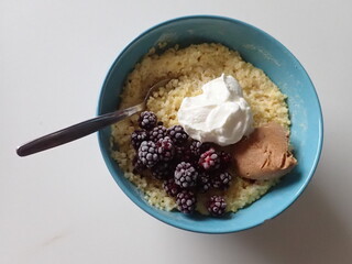 sweet porrifge with fruit and cream