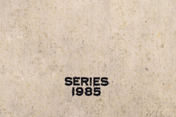 The inscription SERIES 1985 on a dollar bill. Fragment of a dollar bill. Money paper texture