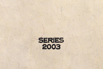 The inscription SERIES 2003 on a dollar bill. Fragment of a dollar bill. Money paper texture