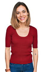 Fototapeta premium Young blonde girl wearing casual clothes with a happy and cool smile on face. lucky person.
