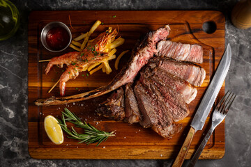 surf and turf, tomahawk steak and shrimps