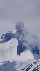 Black tusk mountain covered in clouds during spring in Canada 3