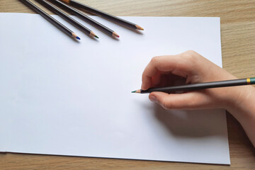 Child hand draws pencil. Study and Free Time. - obrazy, fototapety, plakaty