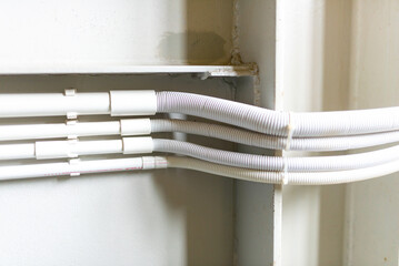 Cables and wires in a white box. Close-up.