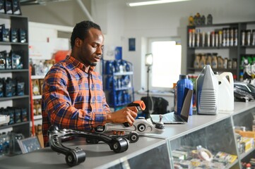 Auto parts store. The seller receives the product and evaluates the quality