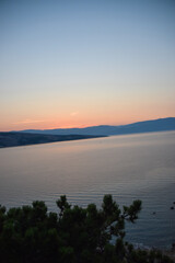 sunrise over the sea, clear sky without clouds. golden hour.	
